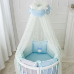Комплект в овальную кроватку 7 предметов «Зайчики» голубой